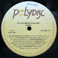 1990-zinho-de-documento-na-mao-selo-b 1990-zinho-de-documento-na-mao-selo-b